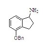 4-芐氧基茚-1-胺
